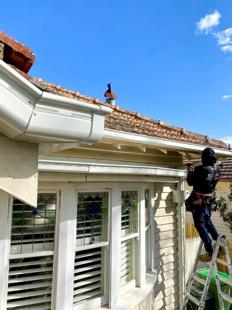 SMP plumber replacing gutters and downpipes that feed the stormwater system